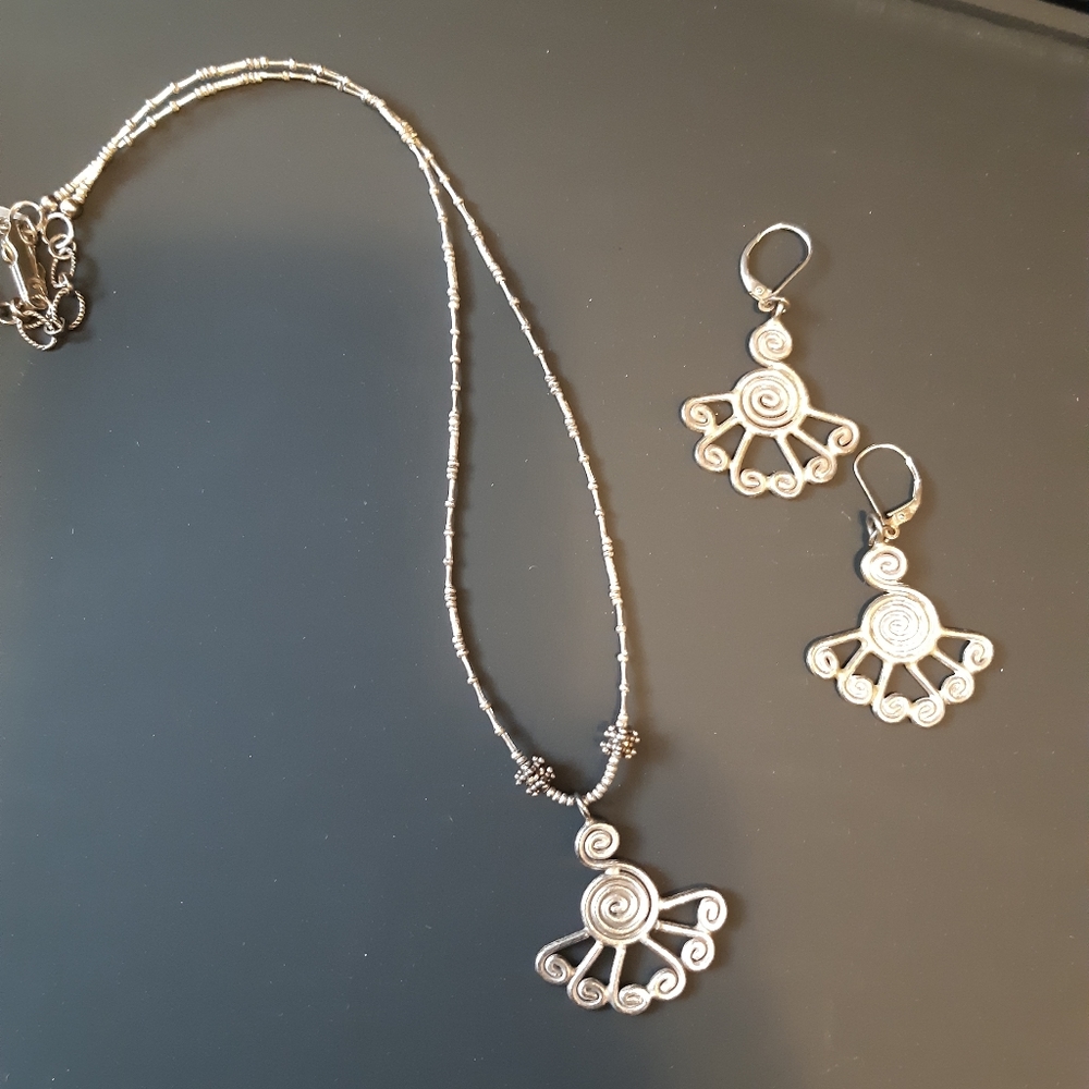 Sterling silver necklace and earrings.